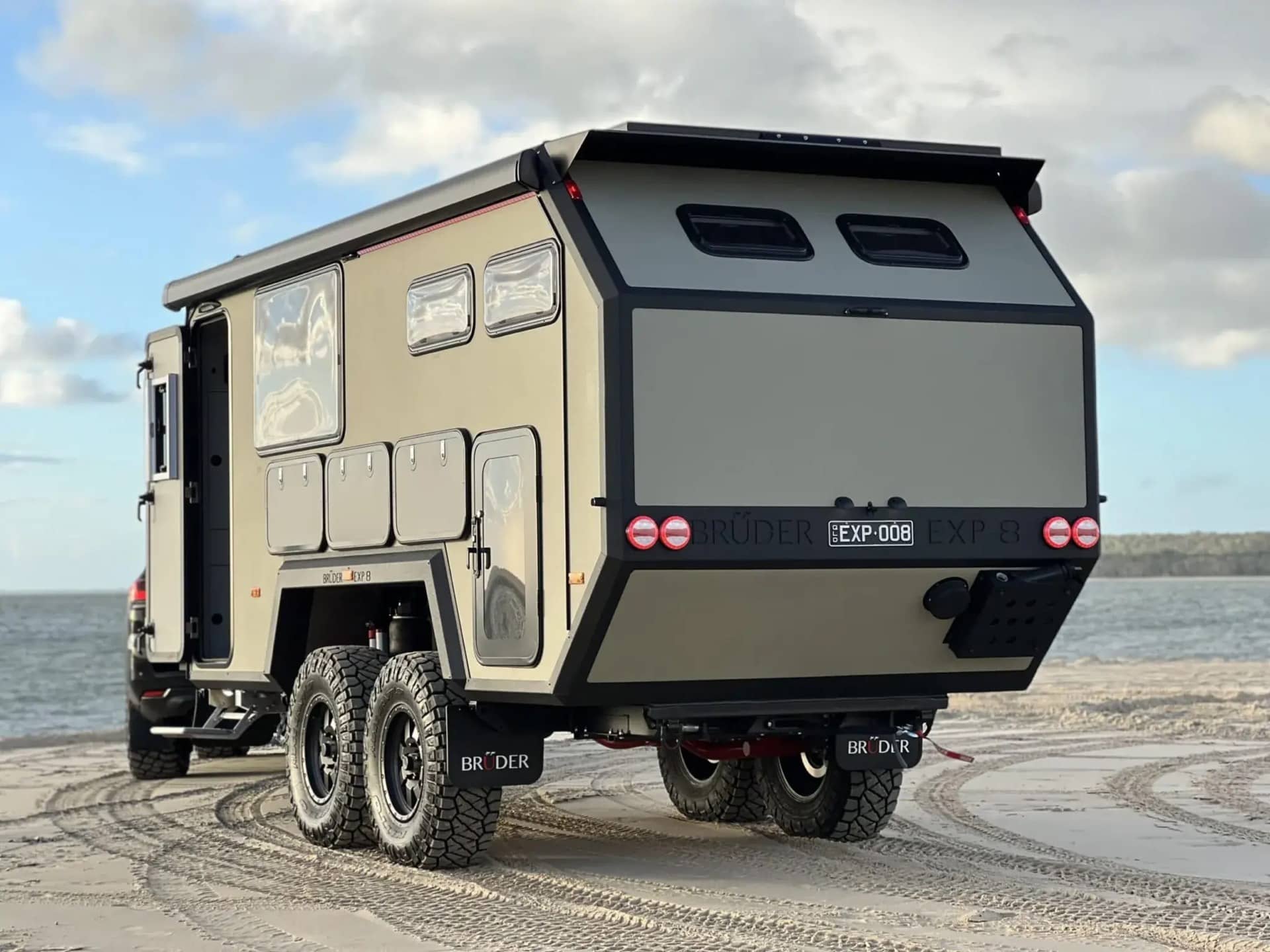 Bruder EXP 8 off-road trailer on a beach